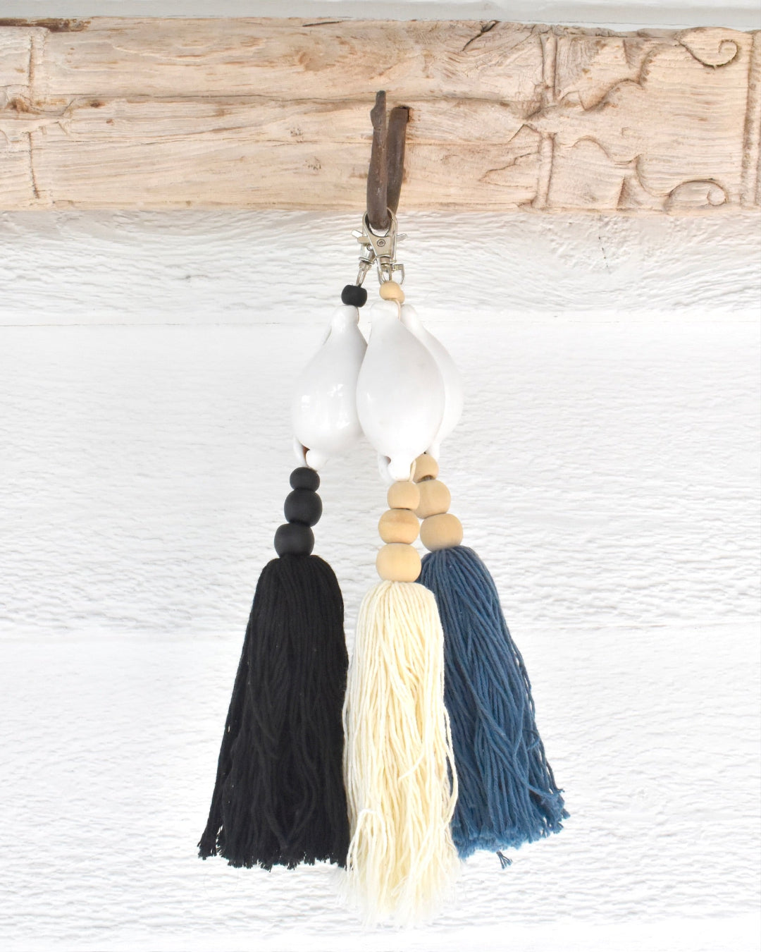 Decorative keychain with tassels on a textured surface