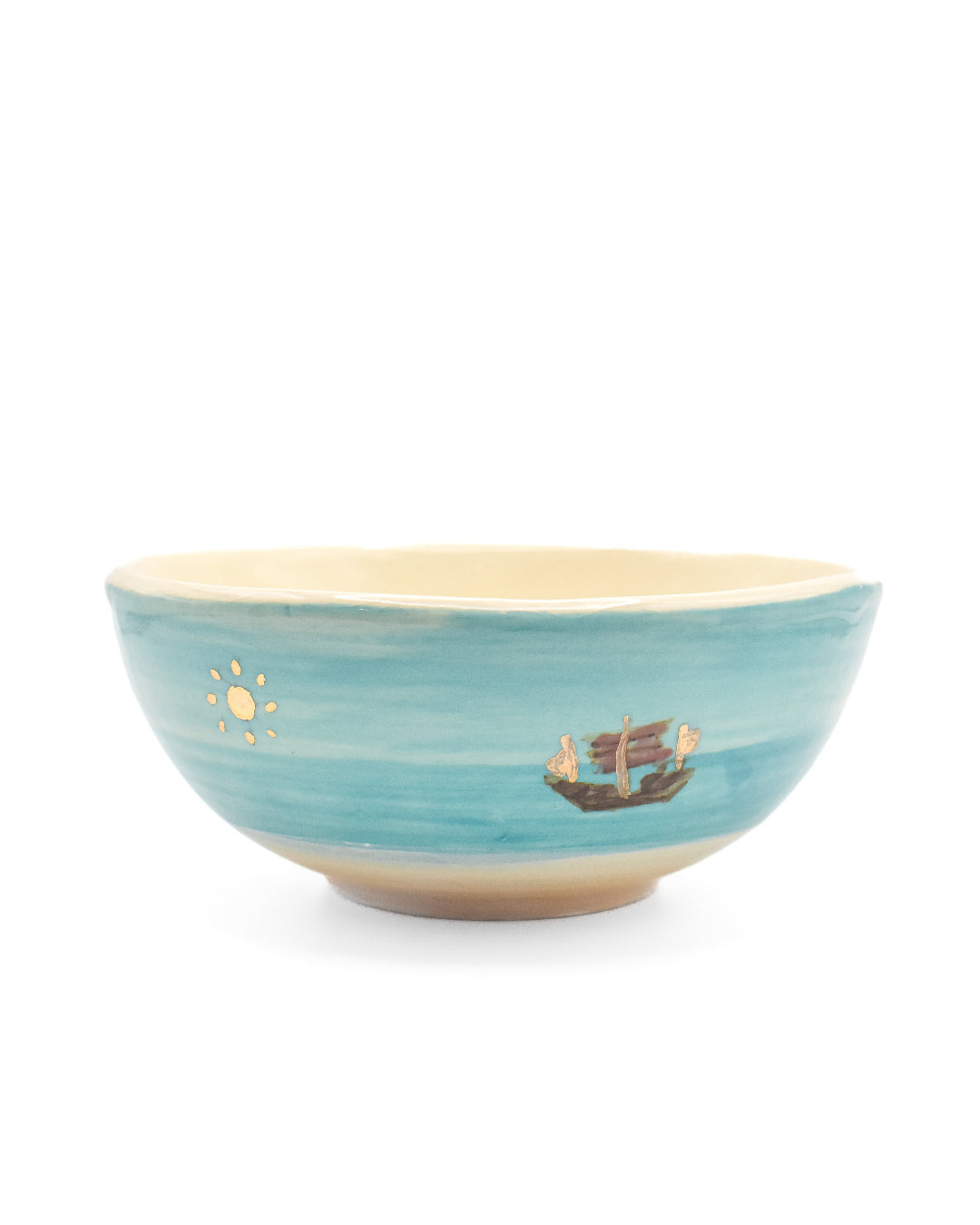 Blue ceramic bowl with decorative elements on a white background
