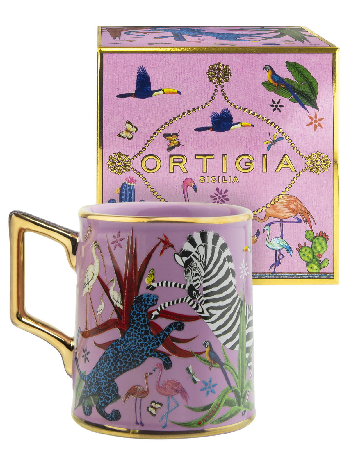 A pink ceramic mug with a gold handle and rim, decorated with colorful safari-themed illustrations including a zebra, leopard, flamingos, toucans, and cacti, shown in front of its matching pink gift box with gold trim. The box features the brand name 'ORTIGIA' and 'SICILIA'.