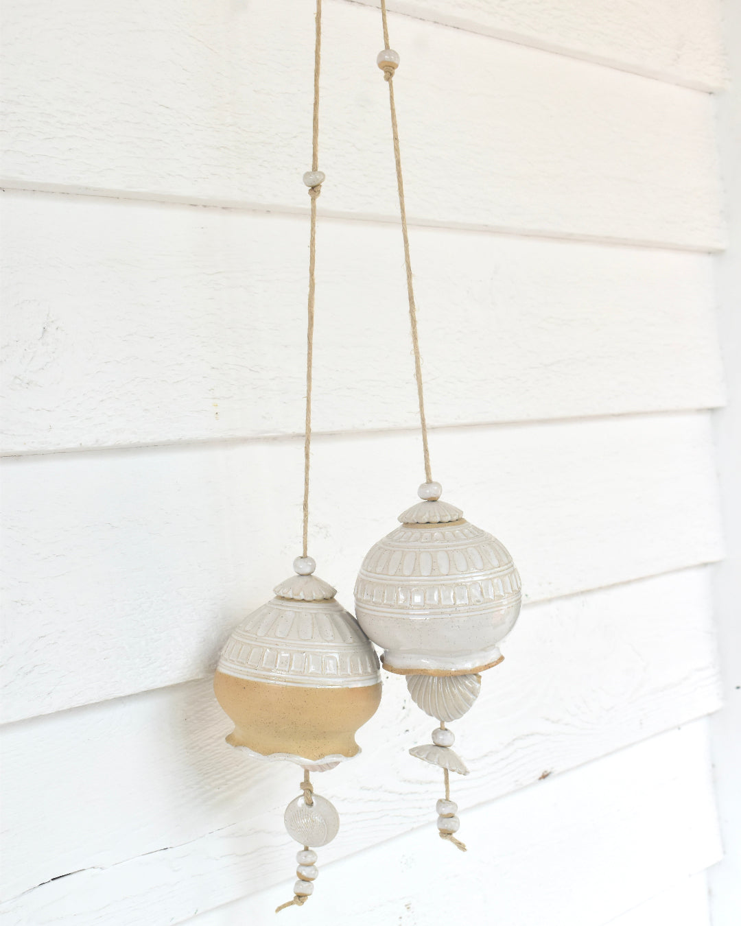 Decorative handmade wind chime on a white background