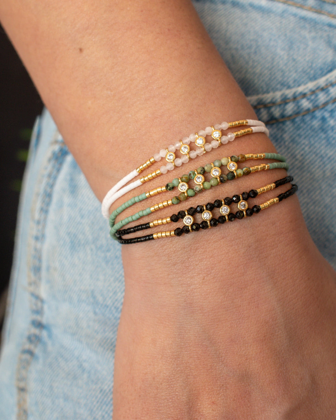 black, torq, white bracelet stack
