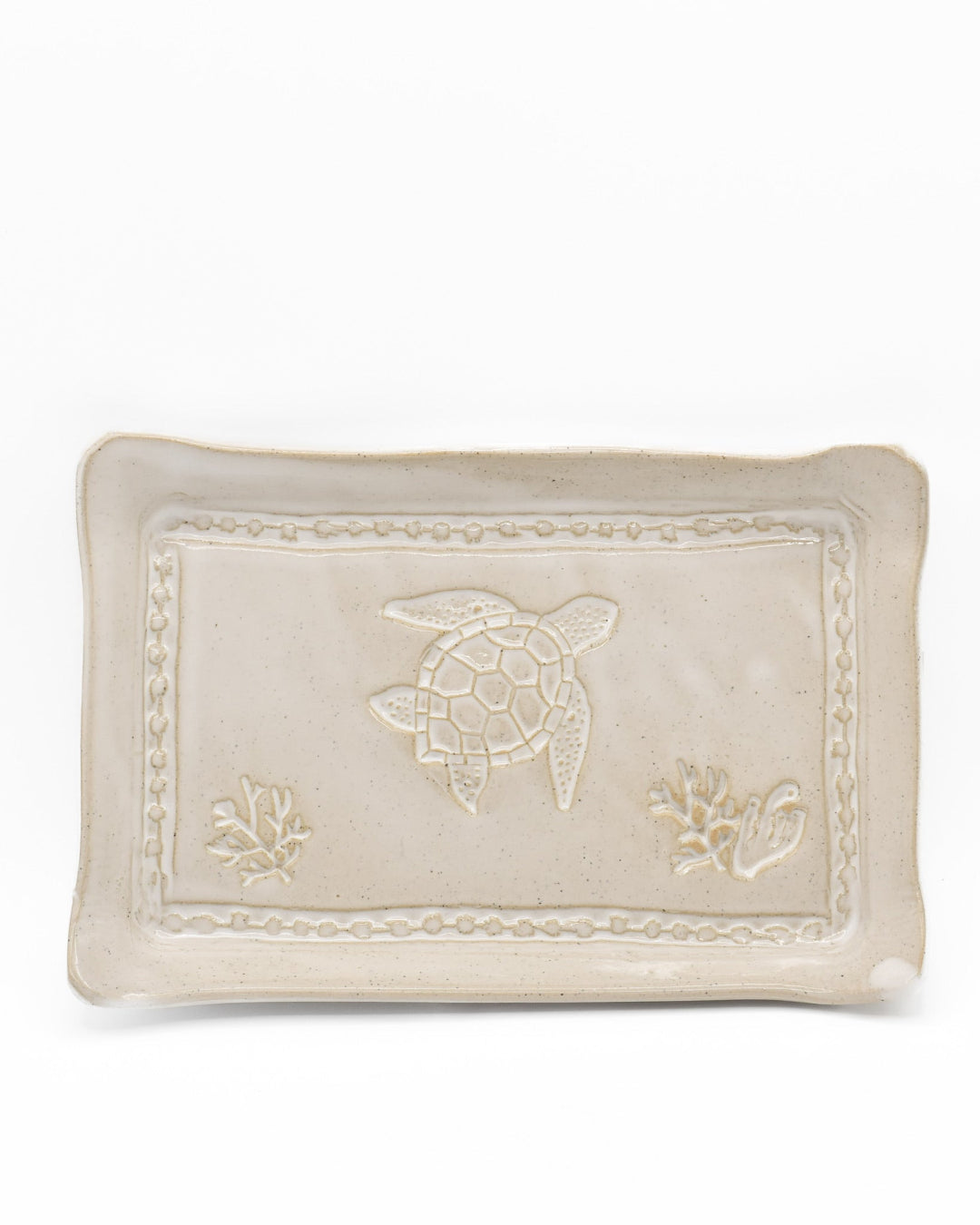 Decorative ceramic tray with turtle design on a white background
