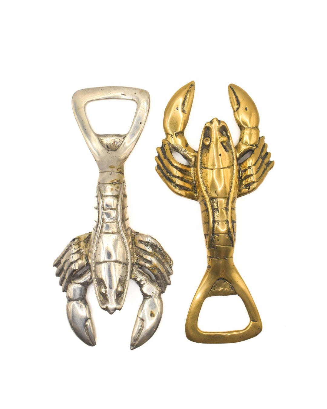 Two lobster-shaped bottle openers, one silver and one gold, on a white background.