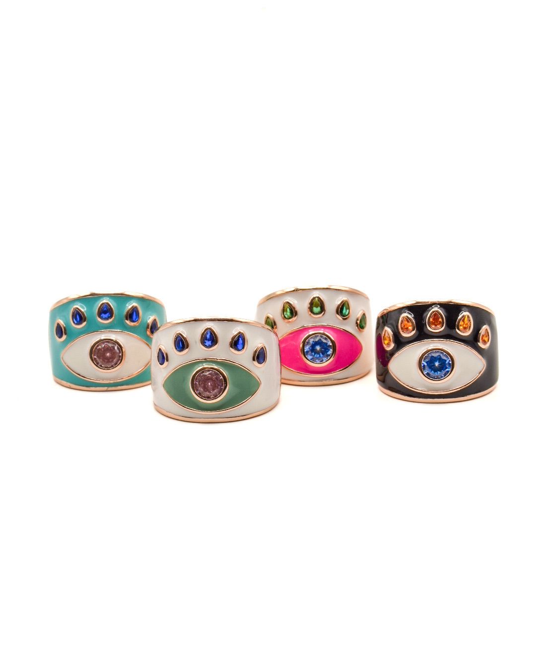 Set of four colorful eye-shaped rings on a white background