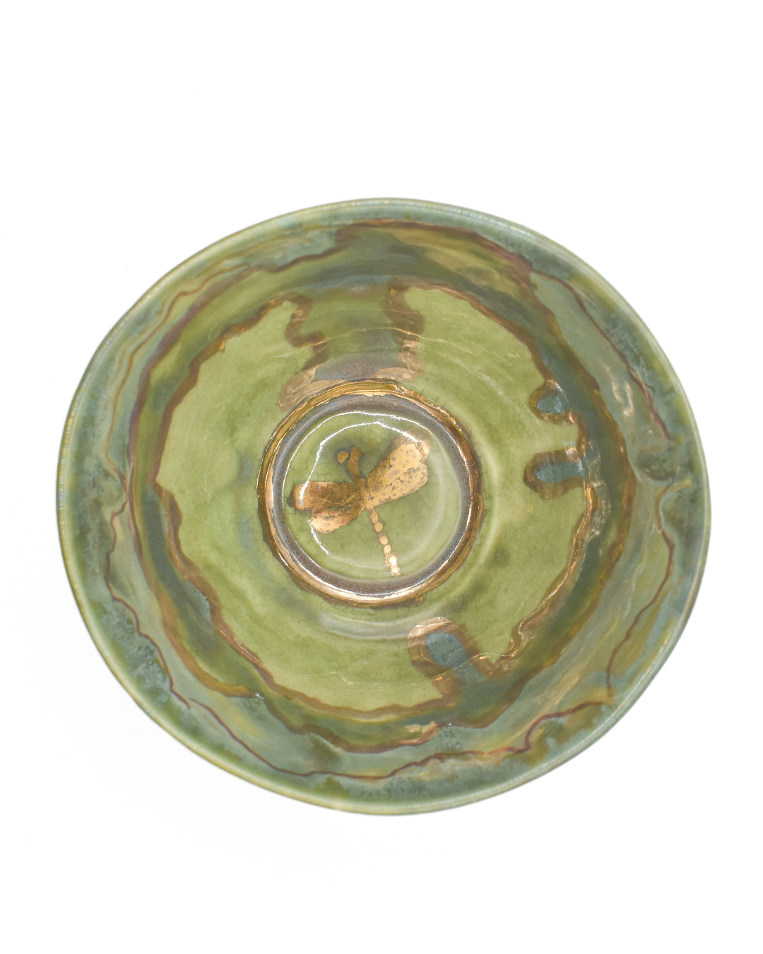 Green ceramic bowl with marbled design on a white background