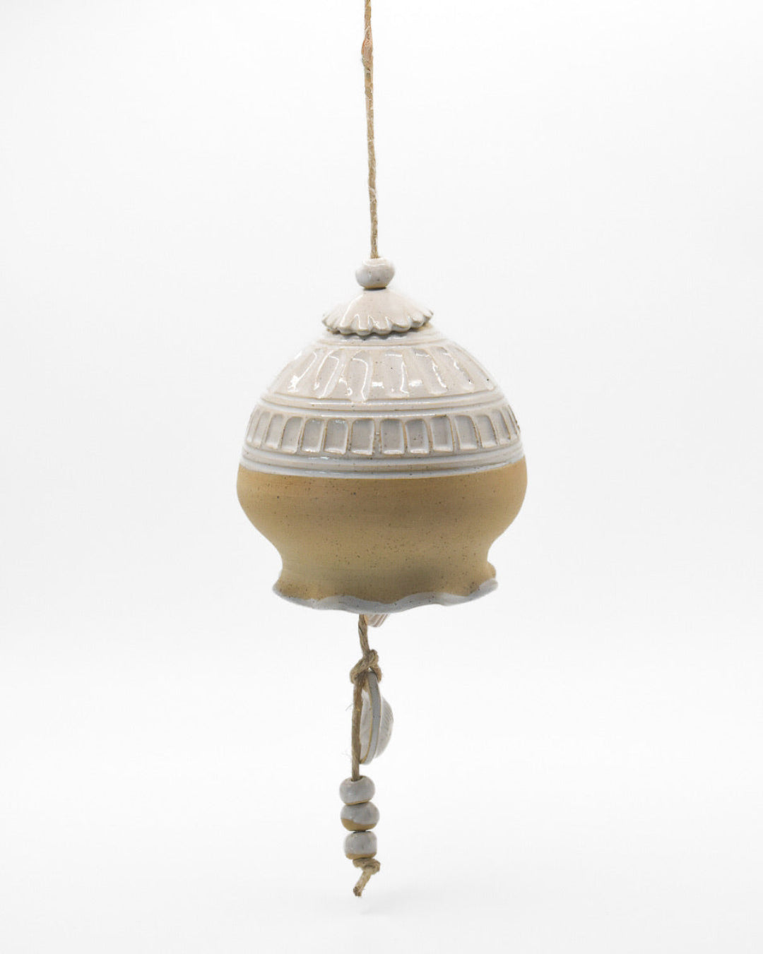 Decorative hanging ceramic ball with textured surface on a white background