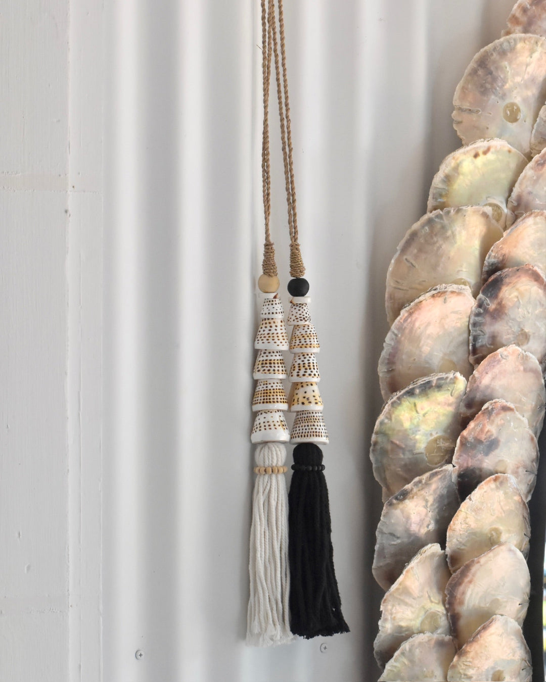 Decorative tassel with intricate patterns on a plain background