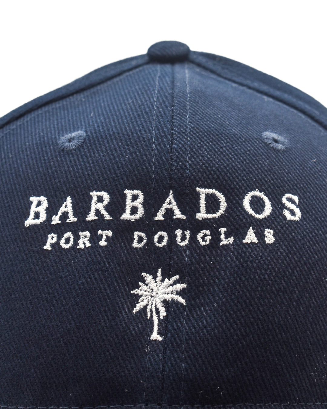Navy blue cap with 'Barbados Port Douglas' text and palm tree design on a white background
