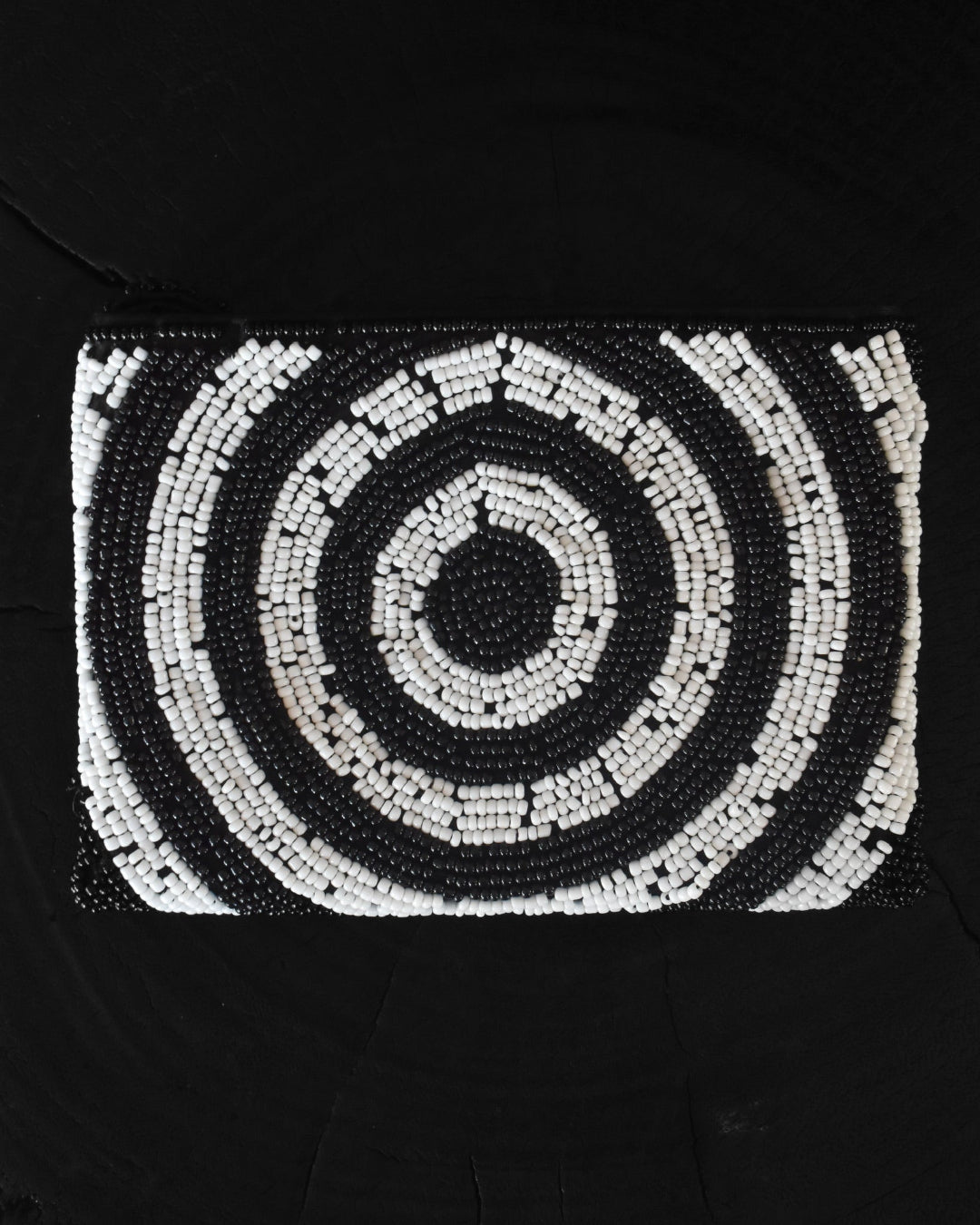 Black and white spiral pattern on a black background