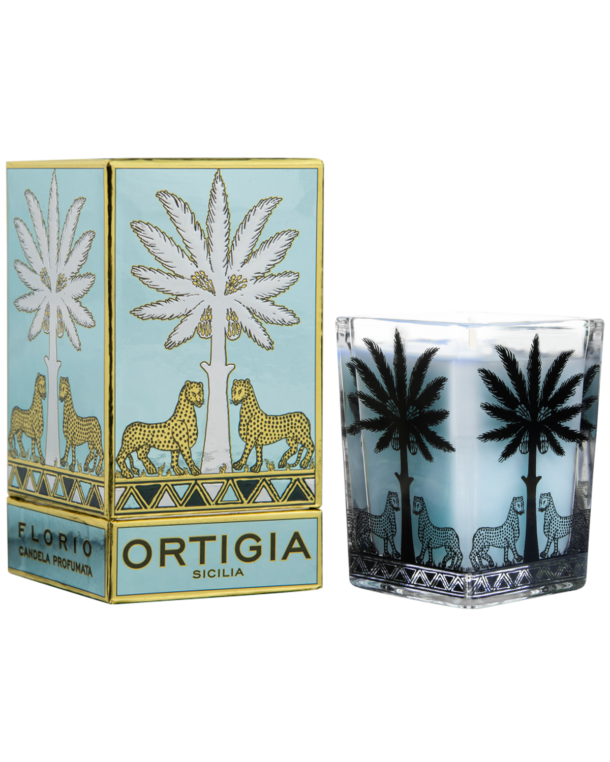 An Ortigia Sicily candle in a clear glass holder with black palm tree and leopard illustrations, shown next to its light blue and gold packaging box.