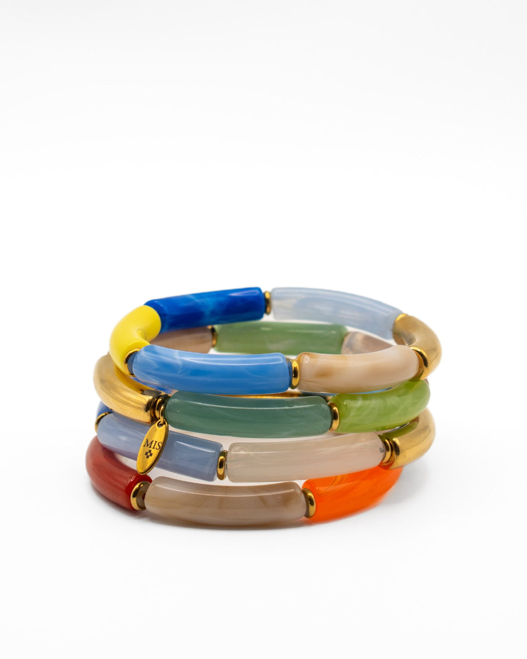 Stack of colorful bracelets on a white background